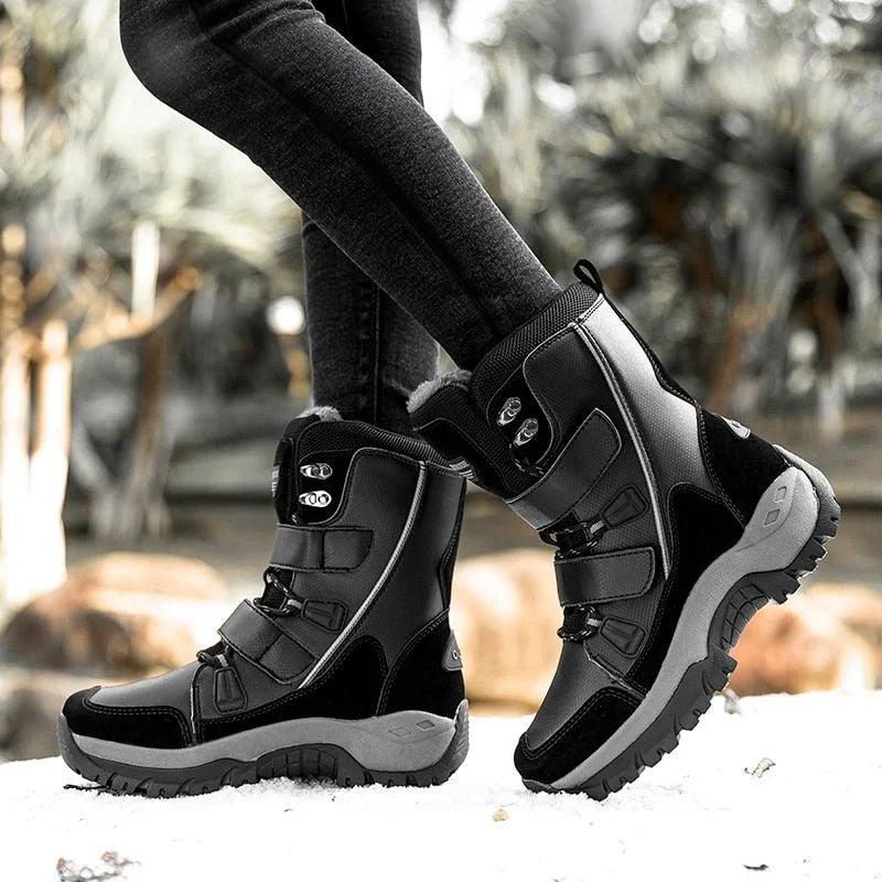 Woman wearing HexoComfy™ Women's Orthopedic High-Top Winter Boots in Black on snow
