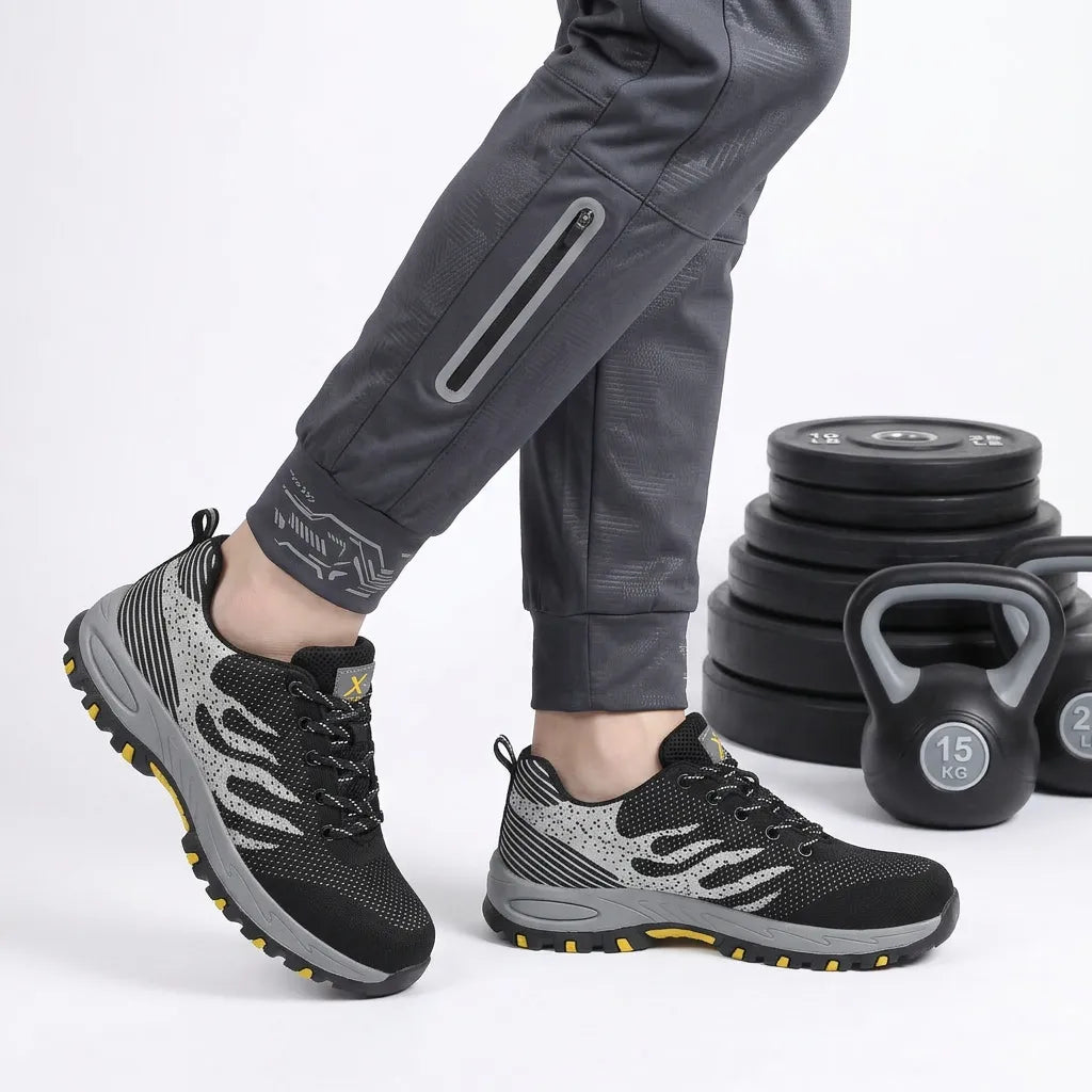 HexoComfy™ Men's Orthopedic Steel Toe Shoes in Black worn with weights in the background