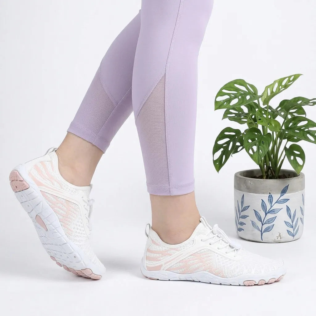 HexoComfy™ Men's Orthopedic Outdoor Shoes in White & Pink worn beside a potted plant