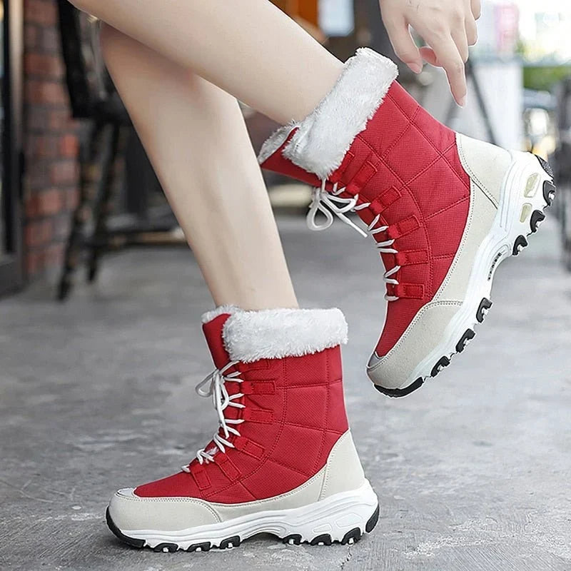 Woman wearing HexoComfy™ Women's Orthopedic Winter Boots in Red on a city pavement